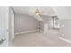Finished bonus room with carpet, neutral paint and plenty of natural light at 109 Aisling Ct, Cary, NC 27513