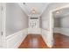 Inviting foyer with hardwood floors, detailed molding, and a decorative glass front door at 109 Aisling Ct, Cary, NC 27513