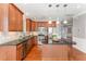 Gourmet kitchen with stainless steel appliances, granite countertops, and a central island at 109 Aisling Ct, Cary, NC 27513