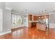 Eat-in kitchen with granite countertops, stainless steel appliances, and cherry wood cabinetry at 109 Aisling Ct, Cary, NC 27513