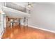 Open-concept living space with hardwood floors, high ceilings, and seamless flow into the kitchen area at 109 Aisling Ct, Cary, NC 27513