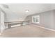 Large loft area with plush carpet, neutral paint, and a window with natural light at 109 Aisling Ct, Cary, NC 27513
