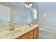 Bright bathroom featuring double sinks, a large mirror and shower at 110 Sudbury Ln, Chapel Hill, NC 27516