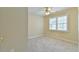 Comfortable bedroom with carpet and a window at 110 Sudbury Ln, Chapel Hill, NC 27516