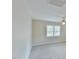 Spacious bedroom with neutral carpet and a window for natural light at 110 Sudbury Ln, Chapel Hill, NC 27516