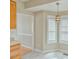 Eat-in kitchen featuring tiled floors, a pendant light and a partial view of wood floors at 110 Sudbury Ln, Chapel Hill, NC 27516