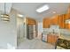 Bright kitchen features stainless steel appliances, light wood cabinets, and granite countertops at 110 Sudbury Ln, Chapel Hill, NC 27516