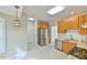Kitchen with stainless steel appliances, wood cabinets, granite countertops and tiled floors at 110 Sudbury Ln, Chapel Hill, NC 27516