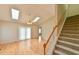 Bright living room with hardwood floors, skylights, and a staircase, creating a welcoming atmosphere at 110 Sudbury Ln, Chapel Hill, NC 27516