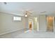 Comfortable main bedroom featuring a ceiling fan, carpet, and ensuite bathroom at 110 Sudbury Ln, Chapel Hill, NC 27516