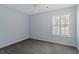 Bedroom with neutral paint, carpet, a ceiling fan, and a window with shutters at 113 Duchess Ln, Chapel Hill, NC 27517