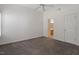 Bright bedroom with carpet, ceiling fan, a window with blinds, and ensuite bathroom entrance at 113 Duchess Ln, Chapel Hill, NC 27517