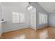 Dining area featuring hardwood floors, white walls, and a window with blinds, creating a bright and inviting space at 113 Duchess Ln, Chapel Hill, NC 27517