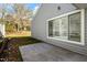 Exterior view of the home with gray siding and a concrete patio at 113 Duchess Ln, Chapel Hill, NC 27517