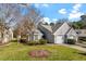 Charming home with a two-car garage, well-manicured lawn, and mature landscaping creates inviting curb appeal at 113 Duchess Ln, Chapel Hill, NC 27517
