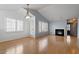 Bright living room boasts a fireplace, recessed lighting, and large windows with plantation shutters at 113 Duchess Ln, Chapel Hill, NC 27517