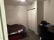 Neutral-toned bedroom featuring a closet and minimalist decor at 113 Warren Ave, Oxford, NC 27565