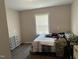 Simple bedroom with a window providing natural light and wood-look floors at 113 Warren Ave, Oxford, NC 27565