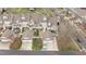 Aerial view of townhomes featuring private garages, yards, and well-maintained landscaping at 1203 Fairview Club Dr, Wake Forest, NC 27587