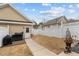 Backyard with a white privacy fence and a grill, offering a private outdoor space at 1203 Fairview Club Dr, Wake Forest, NC 27587