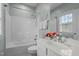 Bright bathroom featuring a tub/shower combo, white vanity and decorative floral accents at 1203 Fairview Club Dr, Wake Forest, NC 27587