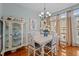 Chic dining room with hardwood floors, modern lighting, and elegant decor at 1203 Fairview Club Dr, Wake Forest, NC 27587