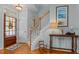 Inviting entryway with hardwood floors, a staircase, and decorative accents at 1203 Fairview Club Dr, Wake Forest, NC 27587