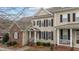 Charming two-story home features a classic design with black shutters and a welcoming front porch at 1203 Fairview Club Dr, Wake Forest, NC 27587