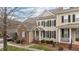 Charming two-story home features a classic design with black shutters and a welcoming front porch at 1203 Fairview Club Dr, Wake Forest, NC 27587