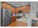 Spacious kitchen features stainless steel appliances, granite countertops, and wood cabinetry at 1203 Fairview Club Dr, Wake Forest, NC 27587