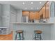 Kitchen with stainless steel appliances, breakfast bar, and light wood cabinetry at 1203 Fairview Club Dr, Wake Forest, NC 27587