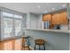 Eat in kitchen with breakfast bar, stainless appliances, and view of the fenced backyard at 1203 Fairview Club Dr, Wake Forest, NC 27587