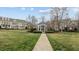 Beautiful gazebo and manicured lawn, with multiple townhomes at 1203 Fairview Club Dr, Wake Forest, NC 27587