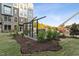 Beautifully landscaped courtyard with stone seating areas, offering a serene environment for residents to enjoy at 1230 Coach Station Alley # 101, Raleigh, NC 27601