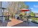 Spacious back deck area with grill and seating perfect for outdoor dining and relaxation at 12504 Ribbongrass Ct, Raleigh, NC 27614