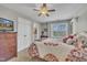 This is a cozy bedroom with great natural light, ceiling fan and neutral walls and trim at 12504 Ribbongrass Ct, Raleigh, NC 27614