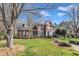Elegant brick home with manicured front lawn and inviting curb appeal at 12504 Ribbongrass Ct, Raleigh, NC 27614