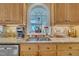 Kitchen sink area with granite counters, and a sunny window view at 12504 Ribbongrass Ct, Raleigh, NC 27614