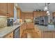Kitchen sink area features granite countertops, stainless steel dishwasher, and cabinet space at 12504 Ribbongrass Ct, Raleigh, NC 27614