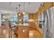 Spacious kitchen with granite countertops, stainless steel appliances, and a center island with seating at 12504 Ribbongrass Ct, Raleigh, NC 27614