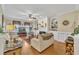 Bright living room with hardwood floors, fireplace, and decorative built-in shelving at 12504 Ribbongrass Ct, Raleigh, NC 27614