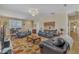 Cozy living room with comfortable seating and a ceiling fan for added comfort at 12504 Ribbongrass Ct, Raleigh, NC 27614