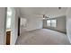 Spacious bedroom featuring a ceiling fan and bright window at 128 Chownings Dr, Sanford, NC 27330