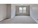 Large bedroom with a carpeted floor and natural light at 128 Chownings Dr, Sanford, NC 27330