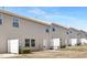 Backyard of townhouse with vinyl siding, small patio, and clear blue skies at 131 Explorer Dr # 257, Morrisville, NC 27560