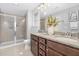 Full bathroom featuring double sinks, granite countertops, and a glass-door shower at 131 Explorer Dr # 257, Morrisville, NC 27560