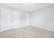 Bright bedroom showcasing neutral carpeting, closet with ample storage, and white walls at 131 Explorer Dr # 257, Morrisville, NC 27560
