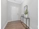 Front entryway with a white door, console table, and dark hard wood floors at 131 Explorer Dr # 257, Morrisville, NC 27560