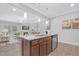 Beautiful kitchen island overlooking living area, complete with pendant lighting and stainless appliances at 131 Explorer Dr # 257, Morrisville, NC 27560