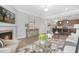 Open living room with a fireplace and bar top view to the kitchen at 131 Explorer Dr # 257, Morrisville, NC 27560